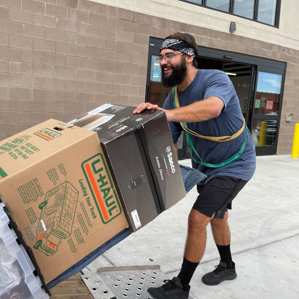 aaron movers employee moving boxes